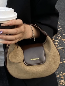 Retro brown hobo bag with khaki suede and leather trim in a stylish street style