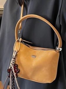 Vintage ginger yellow soft leather bucket bag with top handle and bear charm for women