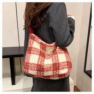 Detail of red and white plaid wool tote bag with our fave label for autumn style