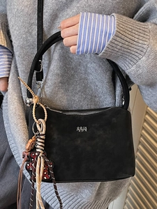 Retro black faux suede bucket bag with round handle and cute bear charm accessory