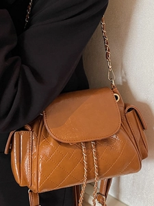 Caramel brown quilted patent leather backpack with gold chain straps for women
