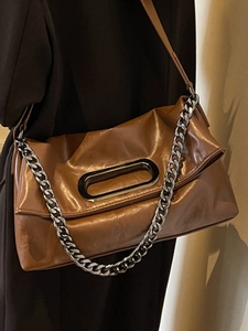 French retro brown pillow bag with silver chain and oval handle for women stylish daily wear