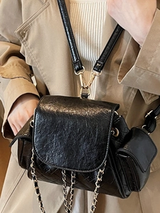 Chic black quilted chain bag with glossy finish and versatile shoulder strap style