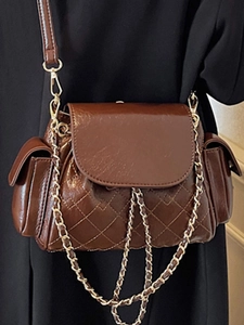 Brown quilted chain bag in glossy PU leather with side pockets and golden hardware