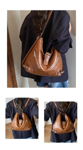 Detail view of brown vintage versatile tote with multi-functional straps for back or shoulder