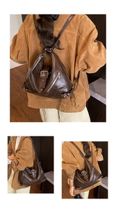 Close-up of vintage brown leather bag details featuring shiny silver zippers and hardware