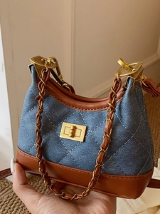Vintage denim and leather crossbody bag with quilted pattern and gold chain strap