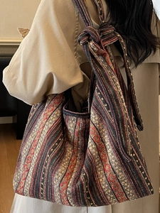 Ethnic style striped canvas tote bag with bohemian knot strap and geometric patterns