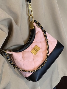 Quilted suede shoulder bag with pink and black patchwork and metal chain strap