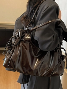 Deep brown vintage glossy patent leather shoulder bag with side drawstring detail