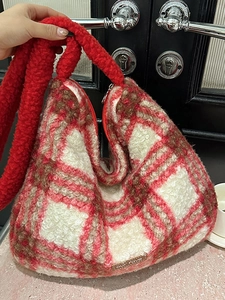 Large capacity red plaid fuzzy tote bag with long fluffy handles and leather tag detail