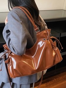 Retro dark brown glossy tote bag with drawstring pleats and long shoulder strap
