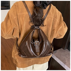 Detailed back view of vintage dark brown PU leather backpack with metallic zippers