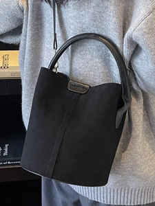 Classic black suede bucket bag for women with leather handle and adjustable shoulder strap