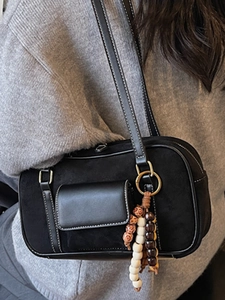 Retro black matte shoulder bag with white contrast stitching and beaded charm detail