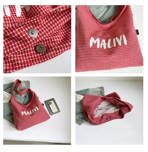 Detail of red checkered canvas tote bag with magnetic snap and MALIVI print