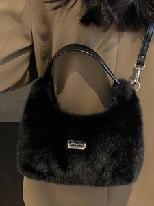 Furry black plush crossbody bag with silver logo plaque and stylish leather handle for women