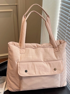 Pink nylon tote bag with front pocket and double handles for daily work or students