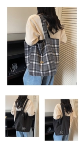 Detail of checkered canvas tote bag and black shoulder bag with cute puppy illustration