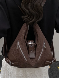 Brown faux leather backpack with leopard texture and edgy triangular geometric design