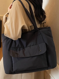 Minimalist black large capacity nylon tote bag with front buckle pockets for women