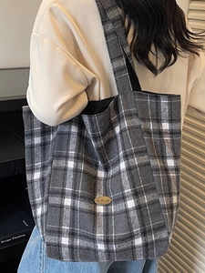 Chic grey and white plaid canvas tote bag with handmade label in a stylish casual look