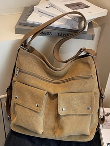 Minimalist canvas shoulder bag with multi-pocket design and adjustable wide strap