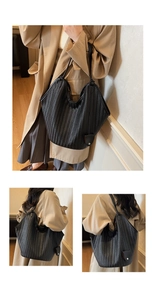 Gros plan d'un sac cabas tissé noir montrant la texture à chevrons et la bandoulière en cuir