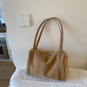 Detail shot of vintage brown matte finish large hobo bag with slim shoulder straps