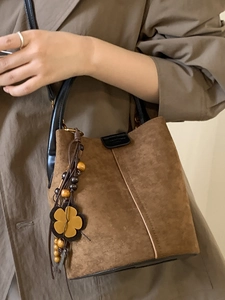 Vintage brown frosted suede bucket bag with ethnic beaded tassel and leather handle
