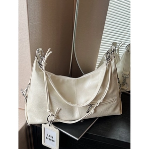 Cream retro textured tote bag with silver hardware and shoulder strap for commute