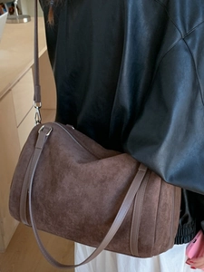 Large vintage dark brown suede cylinder shoulder bag with adjustable strap for women