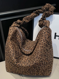 Chic leopard print oversized tote bag with ruched shoulder strap and silver zipper