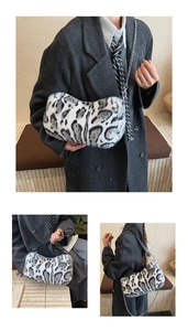 Close-up of grey leopard faux fur bag with metallic chain and leather shoulder strap