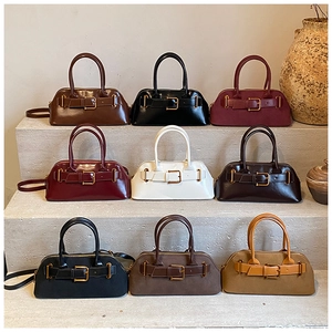 Detailed view of women's vintage leather handbags displayed in nine elegant color variations