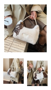 Close-up of white plush handbag with BONNY charm and Love Every Day label detail