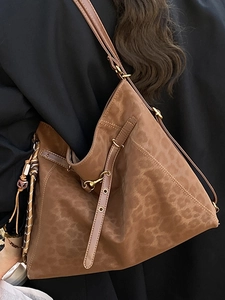 Retro leopard print hobo tote bag with gold hardware and woven pendant detail
