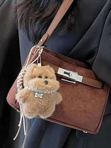 Brown frosted small square crossbody bag with a plush dog pendant and pearl necklace detail