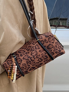 Vintage leopard print cylindrical shoulder bag for women with decorative beaded tassel