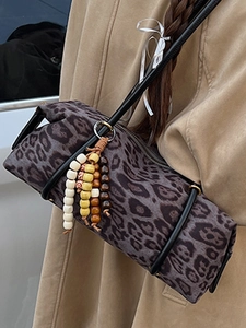 Retro leopard print cylinder shoulder bag with gray animal patterns and beaded charm