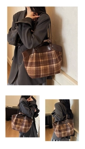 Detail of vintage brown plaid tote bag featuring premium leather trim and sturdy handles