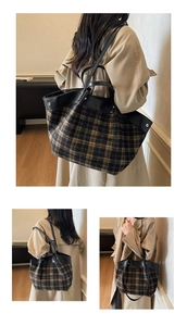Detail view of large check pattern tote bag in black and yellow with leather handles