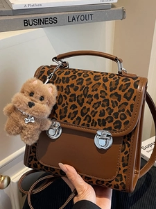 Vintage leopard print backpack and crossbody bag with brown leather and plush charm