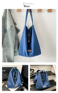 Detail view of ethnic denim tote bag featuring large capacity and our fave leather label