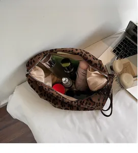 Detailed top view of large leopard print tote bag interior showing ample storage space