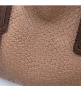 Close-up of khaki woven texture and high-quality stitching on a leather tote bag