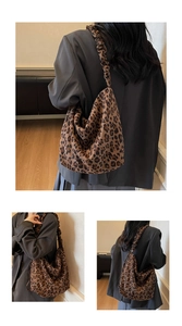 Close-up of leopard print tote bag featuring stylish ruched shoulder strap detail