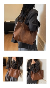 Close-up of brown woven checkered tote bag with long shoulder straps and large capacity