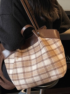 Retro plaid tote bag with brown leather trim and dual shoulder straps for casual wear
