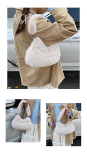 Detail view of cream plush crescent bag featuring fluffy handle and silver chain strap